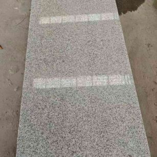 荆州芝麻白光面毛板